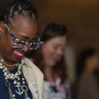 Woman smiling looking down